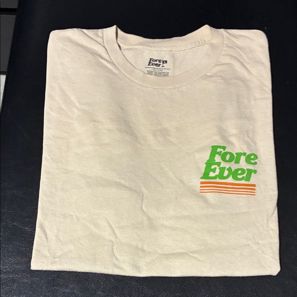 Cream Tee with Green and Orange Design